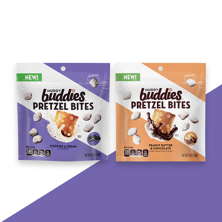 Muddy Buddies Pretzel Bites front of packs being displayed side by side in both cookies & cream flavor and peanut butter & chocolate flavor with a purple graphic background